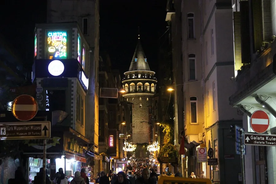police warning noisy group of tourists on street at night Istanbul Turkey