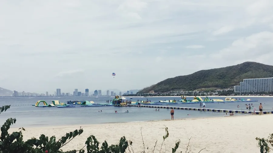 rainy Nha Trang beach with empty sunbeds in November