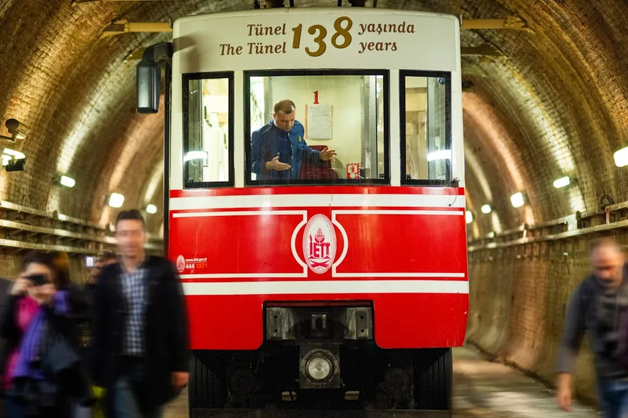 backpacker using mobile phone for payment in Istanbul metro