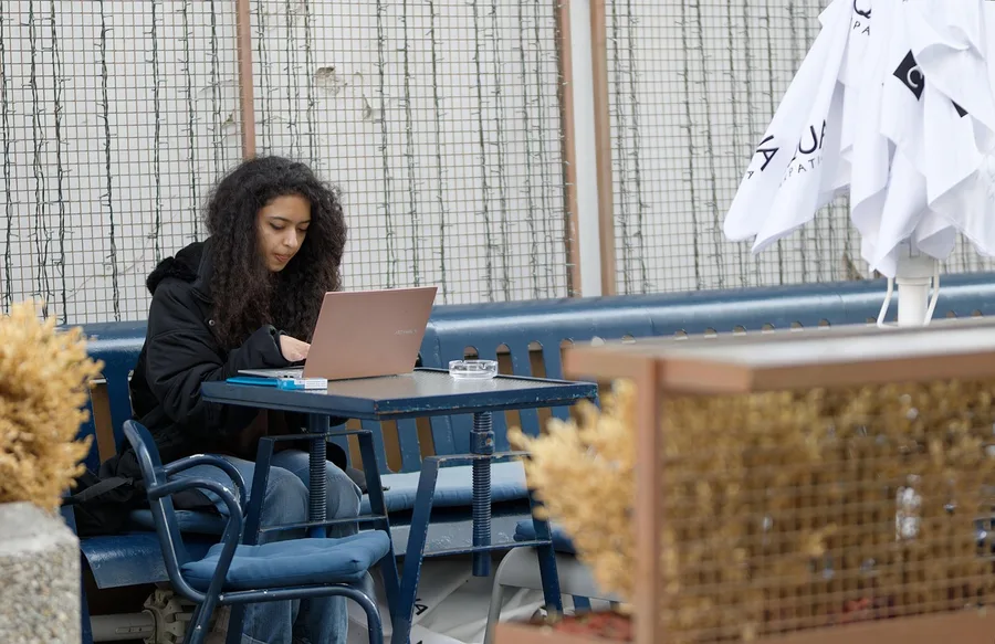 introvert working laptop garden cafe Phuket Oman