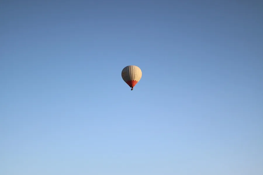 person comparing flight prices on laptop with crypto wallet visible budget travel Turkey Kos Greece