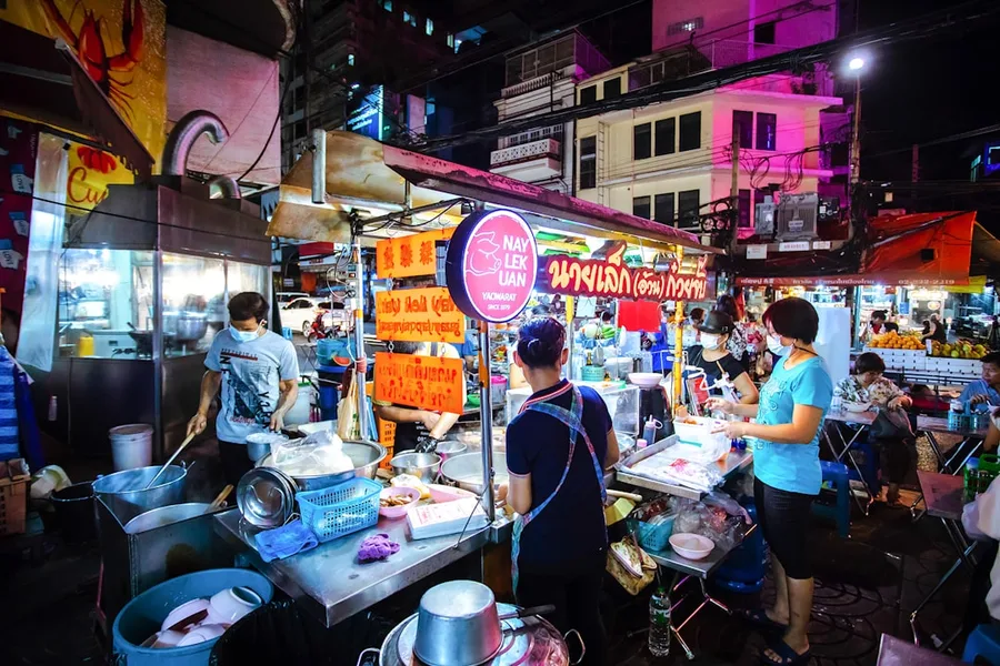 Cash payment in Thai baht at street food vendor Bangkok Thailand