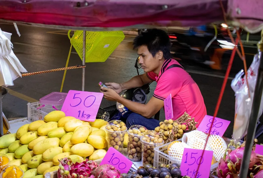 bargaining at Phuket market Thailand