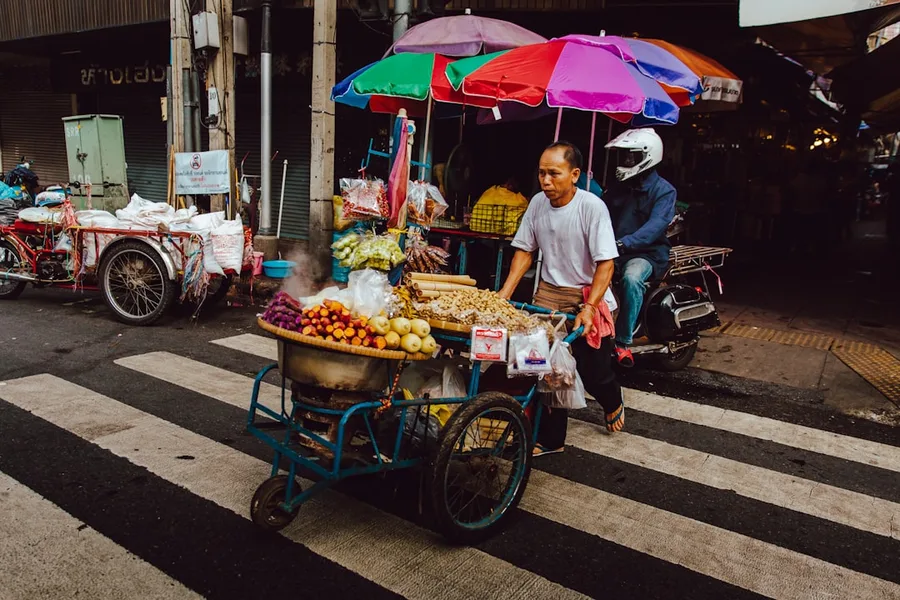 Crypto wallet payment at Bangkok market budget traveler 2026