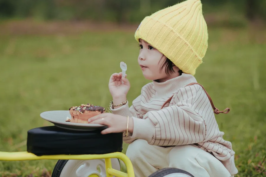 family eating street food Sanya child