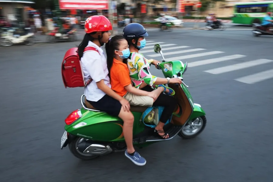 happy gastro tourist eating street food from scooter Vietnam map route Ho Chi Minh City Vietnam