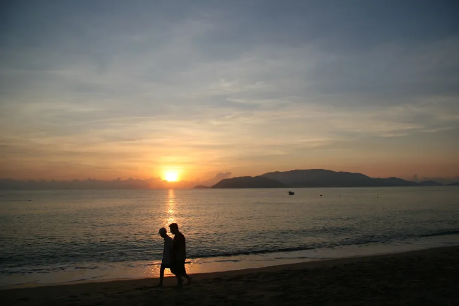 elderly couple on beach Nha Trang Vietnam low cost travel
