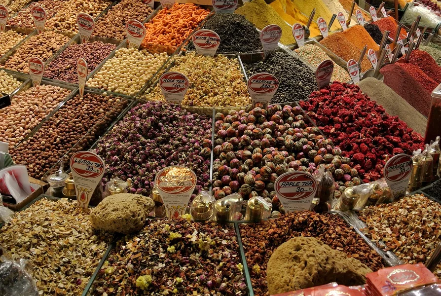 smiling child bargaining with vendor at Grand Bazaar Istanbul