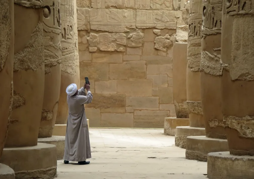 tourist using smartphone to consult online doctor Sharm el-Sheikh Egypt