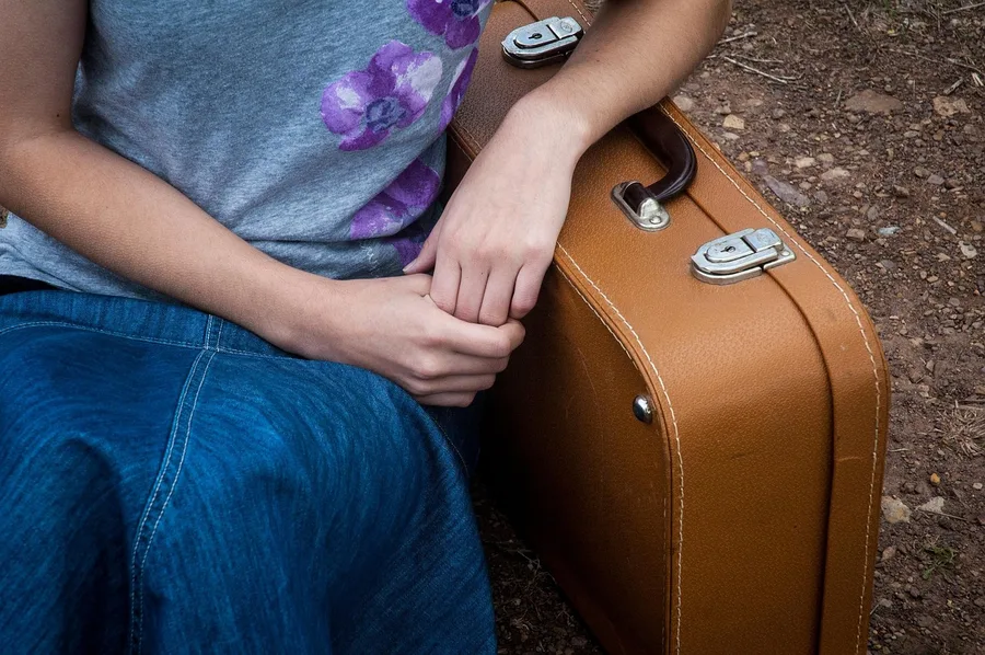 business traveler holding ski bag at Antalya airport oversized luggage desk Turkey