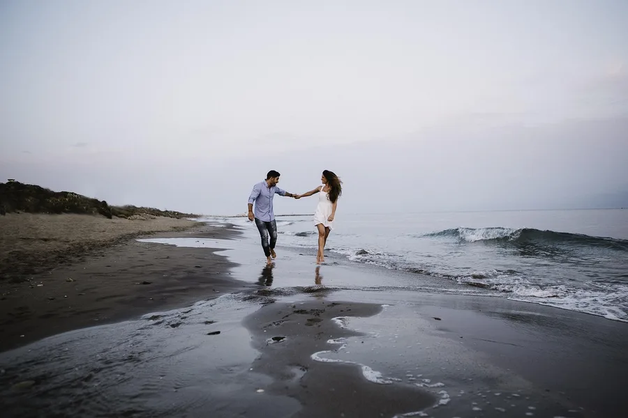 retired couple walking on Caspian Sea beach Aktau Kazakhstan budget vacation Osh Kyrgyzstan