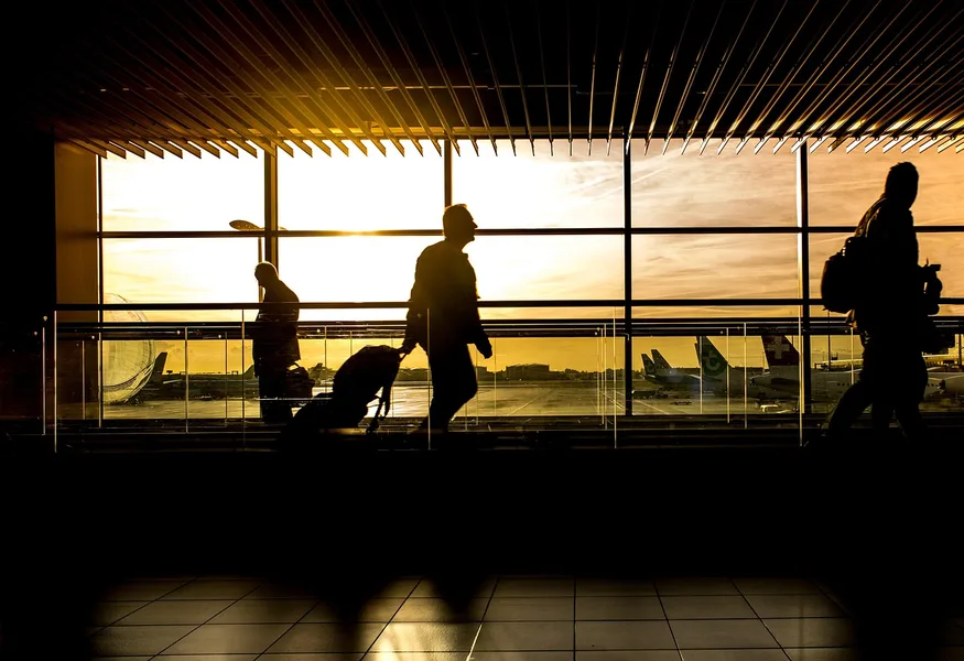 student traveler with backpack waiting at airport departure gate Shenzhen China Hong Kong