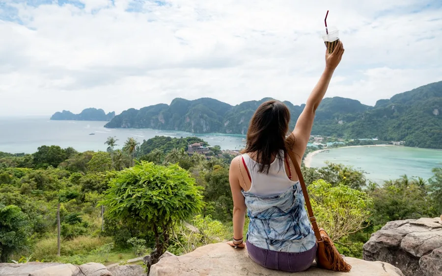 solo woman traveler using mobile payment for safety Thailand Phuket