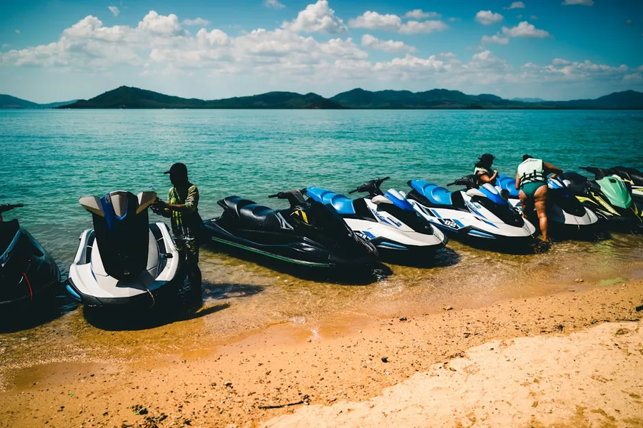 group of friends renting motorbike Phuket Thailand