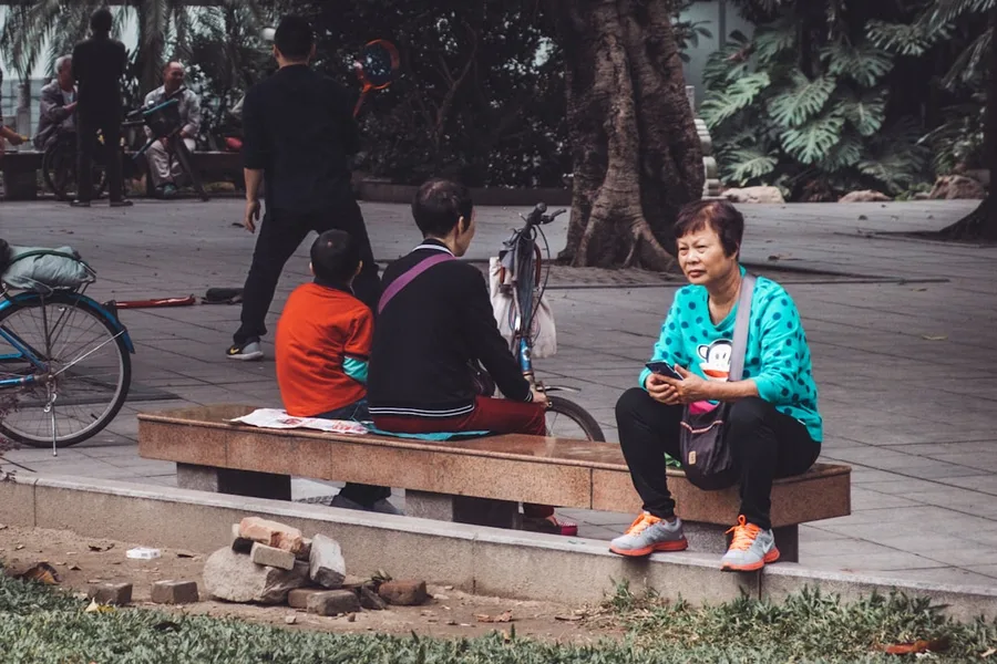 digital nomad using laptop in park Guangzhou China