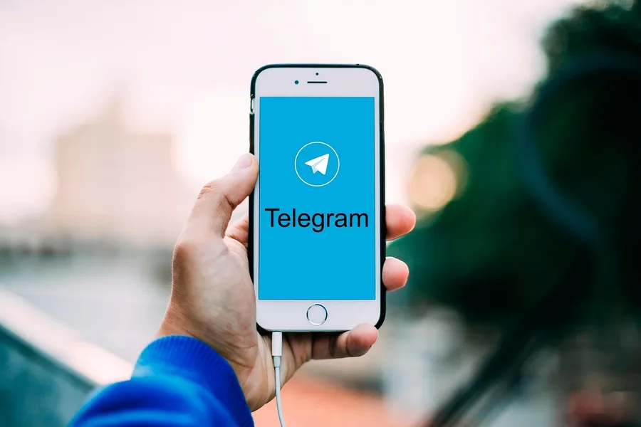 smartphone screen Telegram bot cryptocurrency exchange USDT EGP safe Hurghada