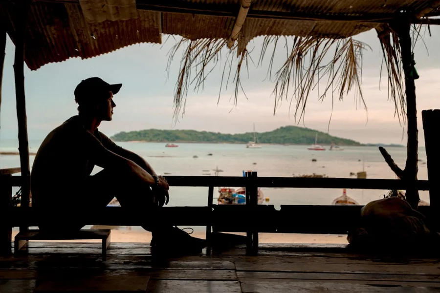co-working space with ocean view introvert reading book Phuket Thailand