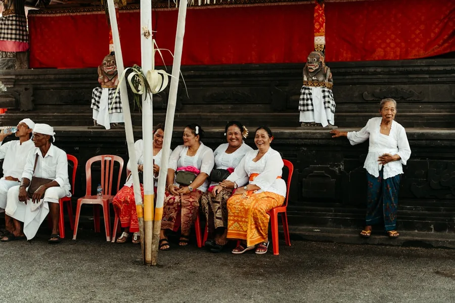 Family with toddler wearing sarong at Tanah Lot Bali Indonesia
