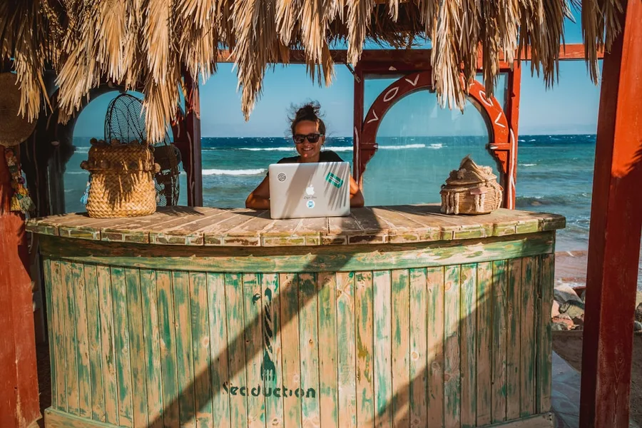 Digital nomad working on laptop in Sharm el-Sheikh cafe Egypt