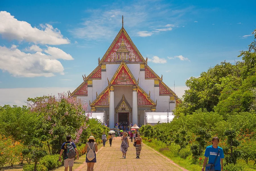 travel insurance policy document with Thai baht and laptop Thailand Phuket Thailand